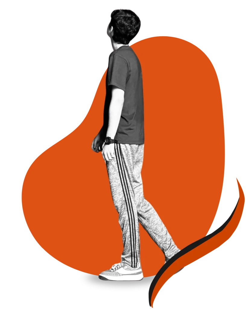 Portrait of Munim Khan, English poet and freelance worker, looking up with abstract orange background