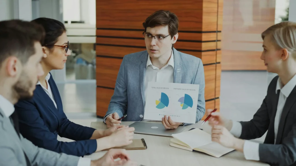 Man showing a graph on Generative Engine Optimization 2026 trends and insights.