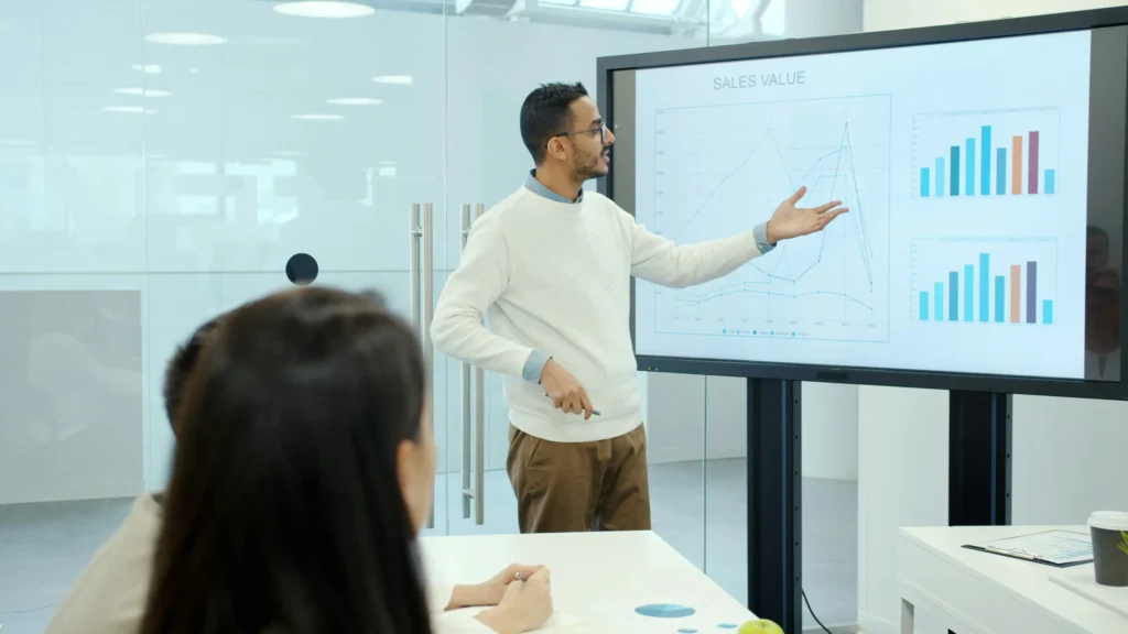Guy explaining a digital marketing chart showing the latest digital marketing trends